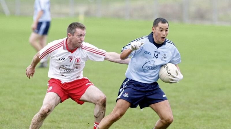 Sean McLaughlin gets to grips with Dublin&#39;s Jason Sherlock during a 2011 charity match between the 1995 teams, in memory of young Cian Corrigan. Picture by Colm O&#39;Reilly 