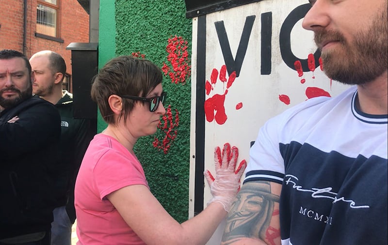 Friends of murdered journalist Lyra McKee used red paint to make handprints on the walls of Saoradh's office in Derry. Picture by Cate McCurry/PA Wire