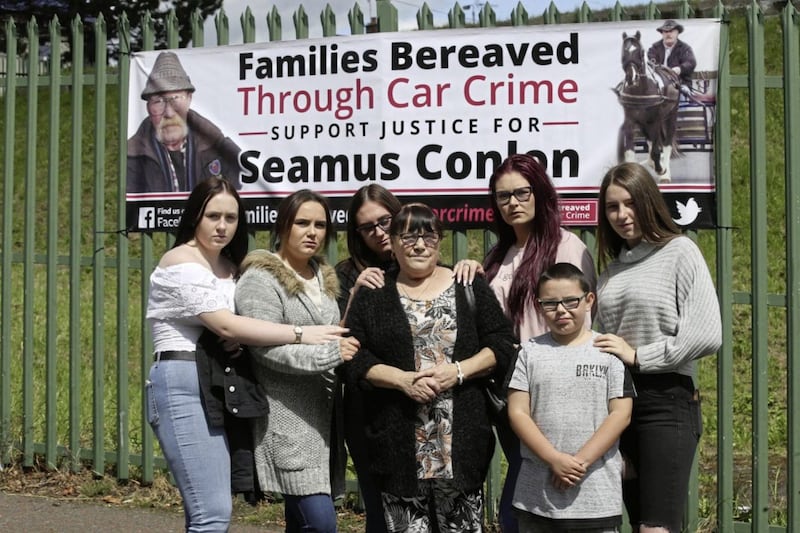 Kay Conlon is accompanied by her grandchildren as she visits the spot for the first time where her husband Seamus Conlon was killed. Picture by Hugh Russell