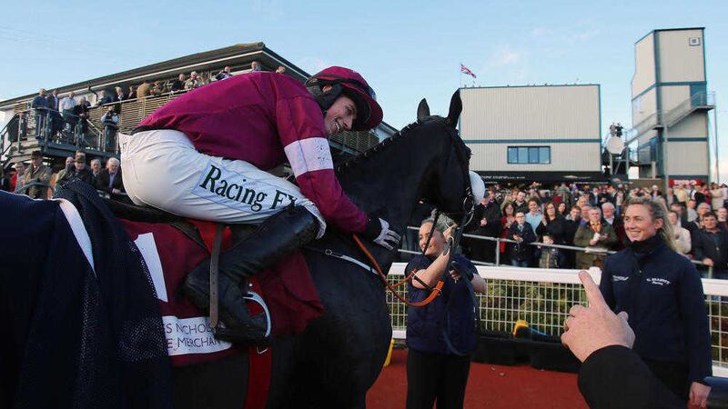 Bryan Cooper celebrates winning The JNwine.com Champion Chase on Don Cossack during day two of the 2015 Northern Ireland Festival of Racing at Down Royal <br />Picture: PA