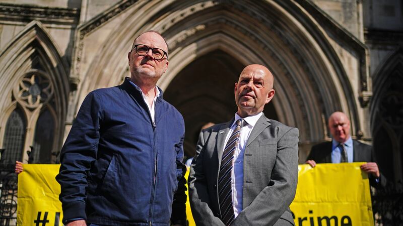 Journalists Trevor Birney, left, and Barry McCaffrey outside the Royal Courts of Justice, in London