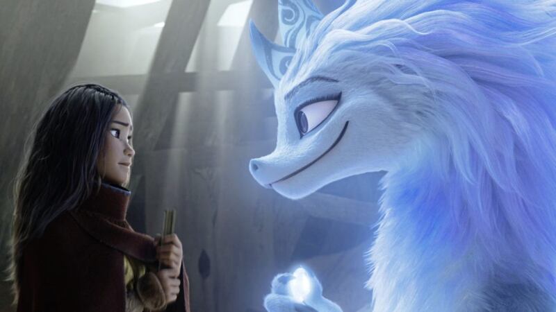 Raya, voiced by Kelly Marie Tran, and dragon Sisu, voiced by Awkwafina, in Raya and The Last Dragon