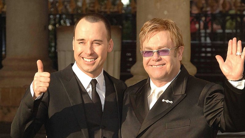 Sir Elton John (right) pictured with his husband David Furnish said he had talked to the Russian President about gay rights