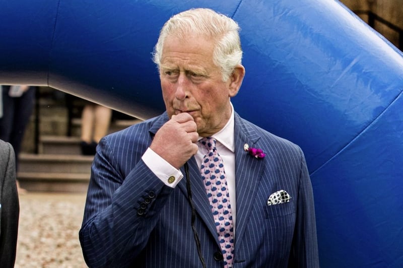 The Prince of Wales blowing a whistle as he referees a cross-community match at Palace Demense in Co Armagh PICTURE: Liam McBurney/PA 
