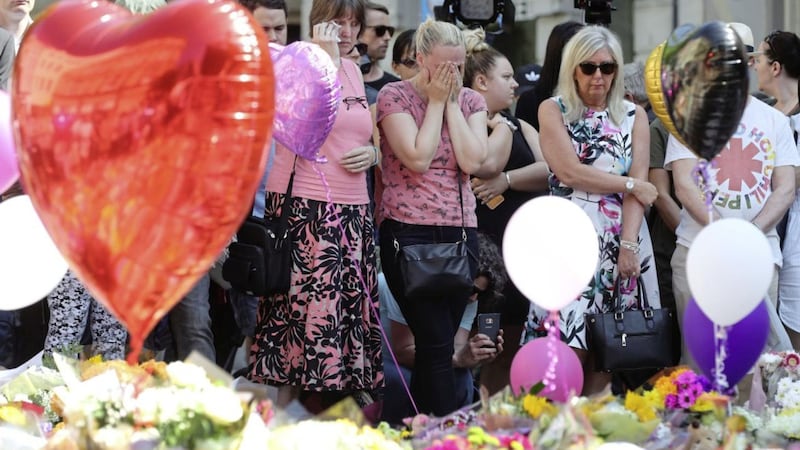 People observe a minute&#39;s silence in St Ann&#39;s Square, Manchester PICTURE: Owen Humphreys/PA 