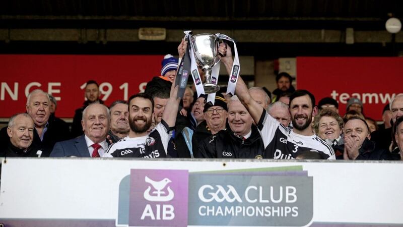Kilcoo&#39;s joint captains Aidan Branagan and Conor Laverty lift the Seamus Mac Ferran Cup after defeating Naomh Conaill yesterday in the final at Healy Park. Picture by Seamus Loughran 
