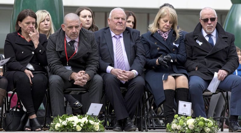 Wendy and Colin Parry (both right), the parents of Tim Parry, 12, and Paul Comerford (second left) the brother of Johnathan Ball, three, who were both killed in the IRA Warrington bombing attack, sit during the 25th anniversary service of the Warrington bombing, on Bridge Street, attended by the families of victims of the attack, faith leaders and representatives of the British and Irish governments. PRESS ASSOCIATION Photo. Picture date: Tuesday March 20, 2018. See PA story MEMORIAL Warrington. Photo credit should read: Peter Byrne/PA Wire. 