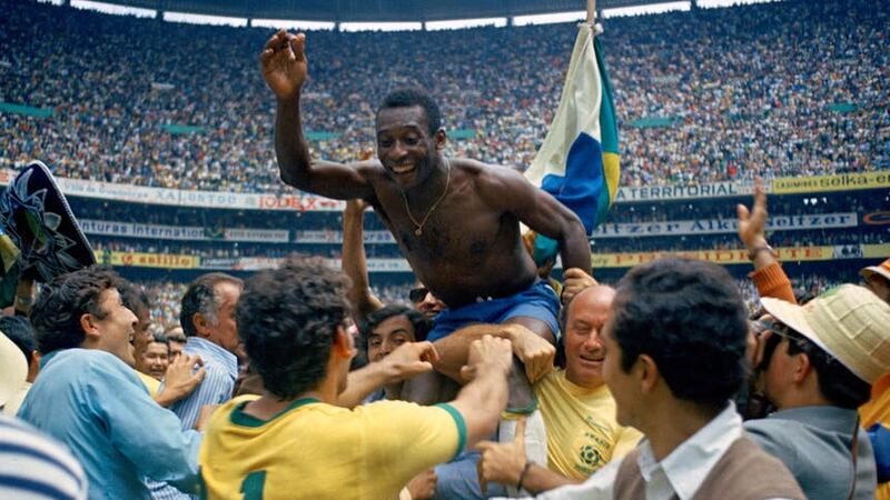 Brazil’s Pele is hoisted on the shoulders of his teammates (AP)