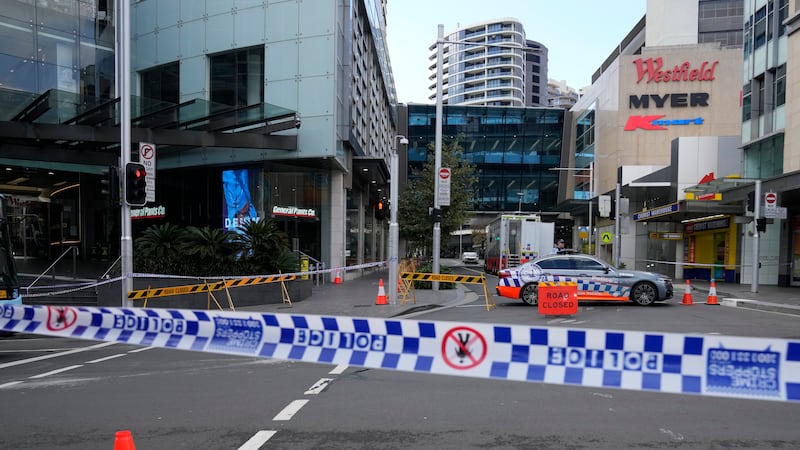Police block a street near a crime scene at Bondi Junction in Sydney (Rick Rycroft/AP)