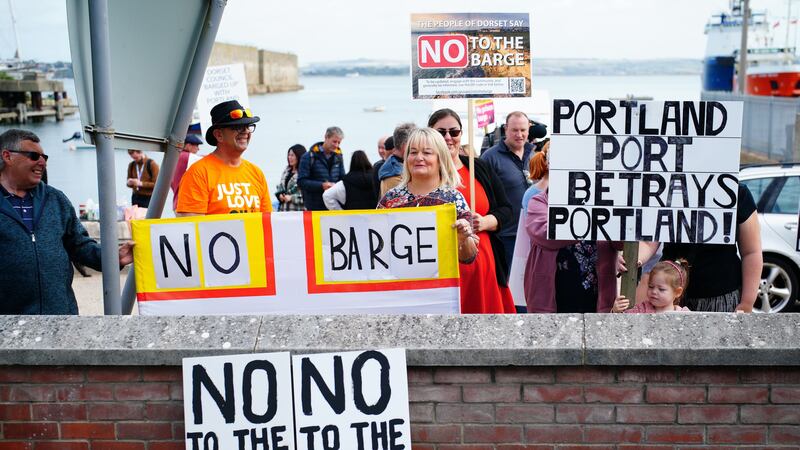 Protesters in Portland in Dorset after the Bibby Stockholm accommodation barge arrived (Ben Birchall/PA)