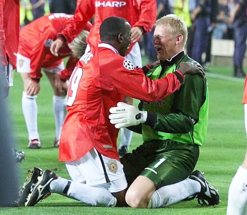 Peter Schmeichel, right, and Dwight Yorke celebrate Manchester United’s Champions League victory in 1999
