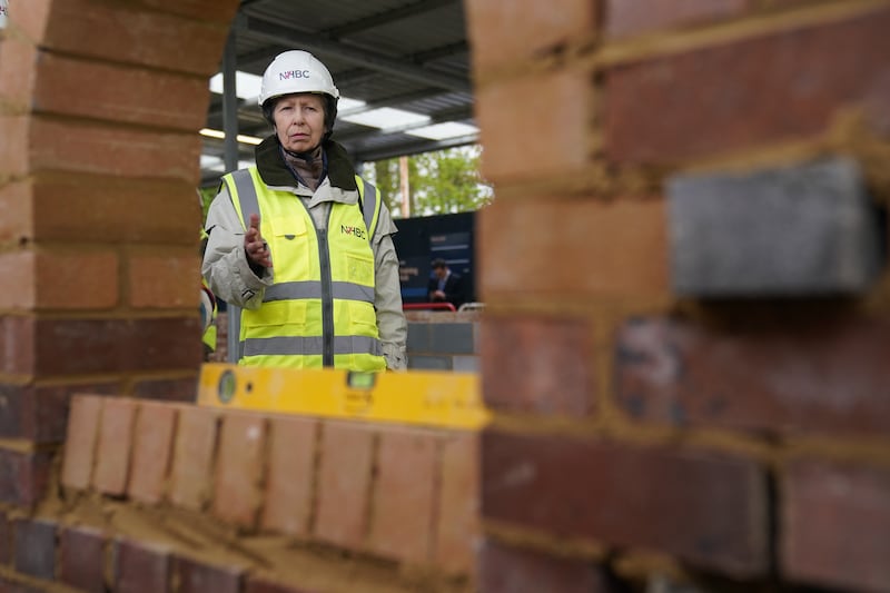 The Princess Royal wore a white hard hat and yellow hi-vis jacket for the visit