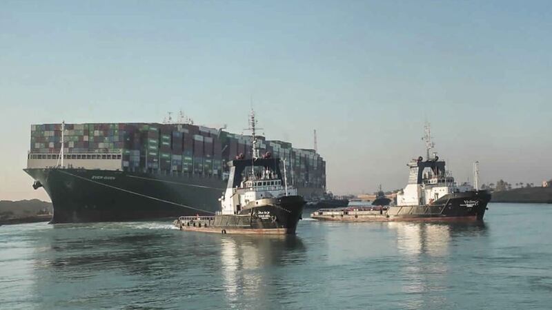 &nbsp;In this photo released by Suez Canal Authority, the Ever Given, a Panama-flagged cargo ship is pulled by Suez Canal tugboats, in the Suez Canal, Egypt, on Monday March 29 2021
