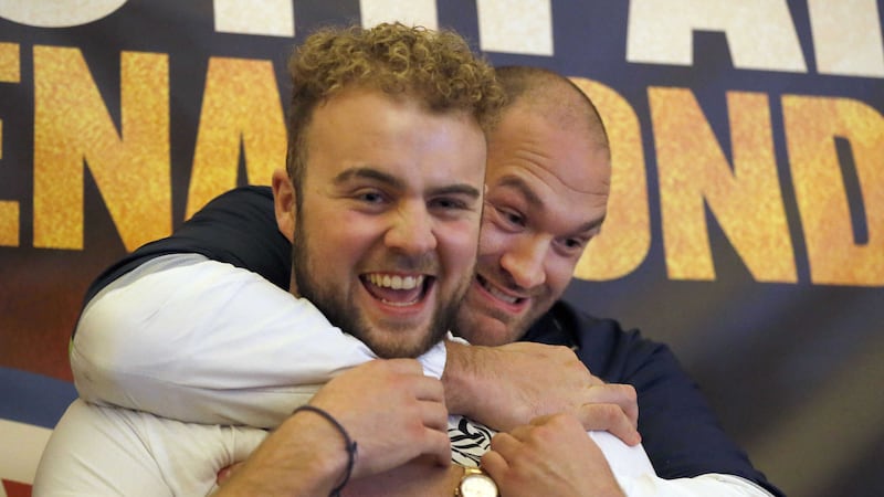Tyson Fury, WBA and WBO heavyweight champion, and fellow fighter Nathan Gorman during a press conference in London on Wednesday<br />Picture by PA