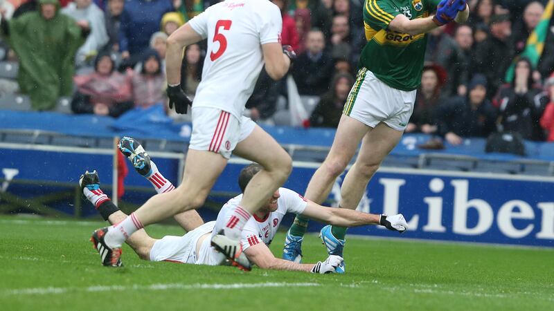 Tyrone's players struggle vainly to stop Kerry's Colm Cooper at Croke Park on Sunday<br/>Picture: Hugh Russell