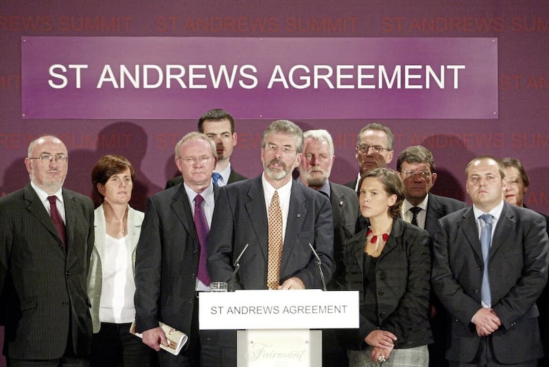 Sinn Fein President Gerry Adams and party colleagues speak to the media at St Andrews in 2006