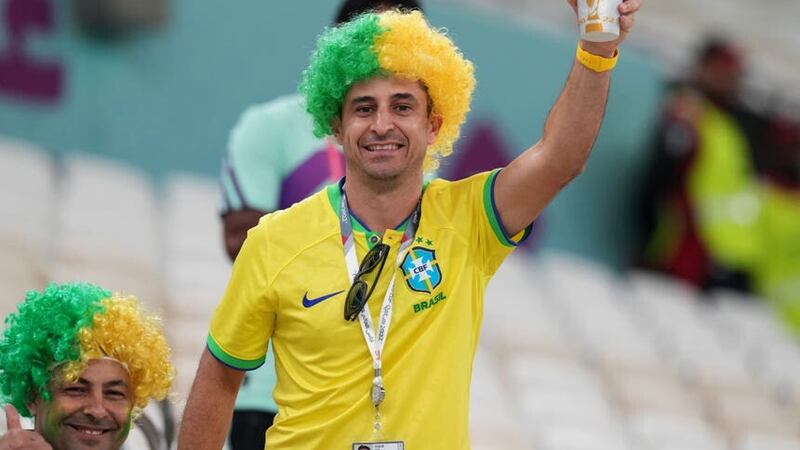 A fan of Brazil drinking a non-alcoholic Budweiser Zero beer at a World Cup match in Qatar last year (Peter Byrne/PA)
