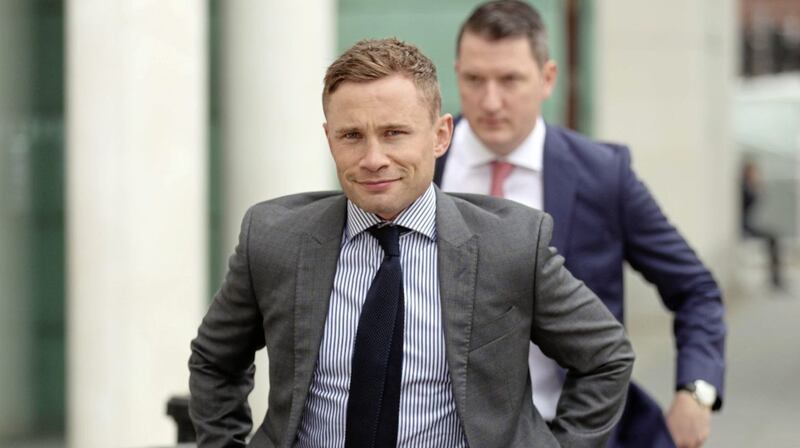 Former boxing world champion, Carl Frampton arrives at Belfast High court this morning with his legal counsel, John Finucane for his legal battle with his former manager, Barry McGuigan..Picture by Stephen Davison 