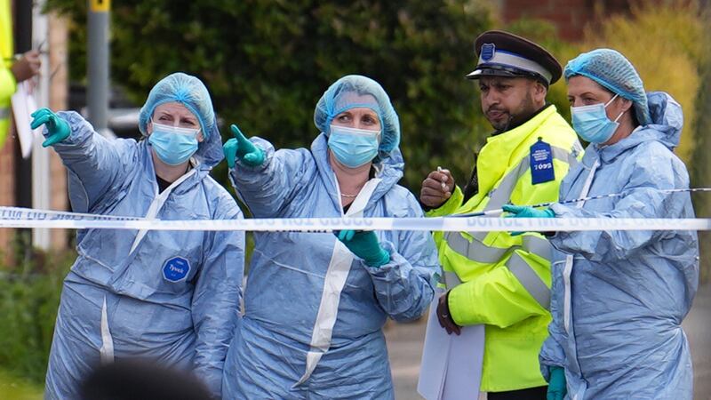 Forensic investigators in Laing Close in Hainault, north east London on Tuesday.