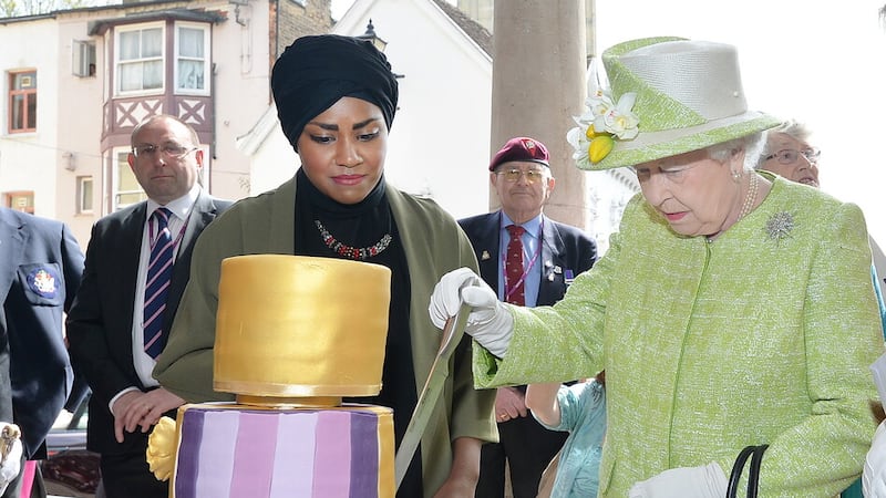Queen Elizabeth II with Nadiya Hussain, winner of the Great British Bake Off, who baked a cake for her 90th birthday (John Stillwell/PA)