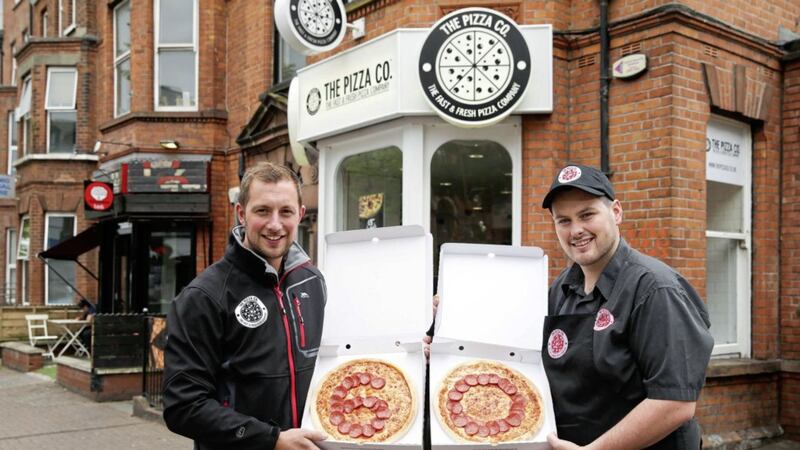Martin Conlon, co-owner of The Pizza Co and The Chip Co, is pictured with manager of The Pizza Co in Botanic, Matthew Stevenson. The group is to create 60 new jobs over the next three months with the opening of three new outlets 