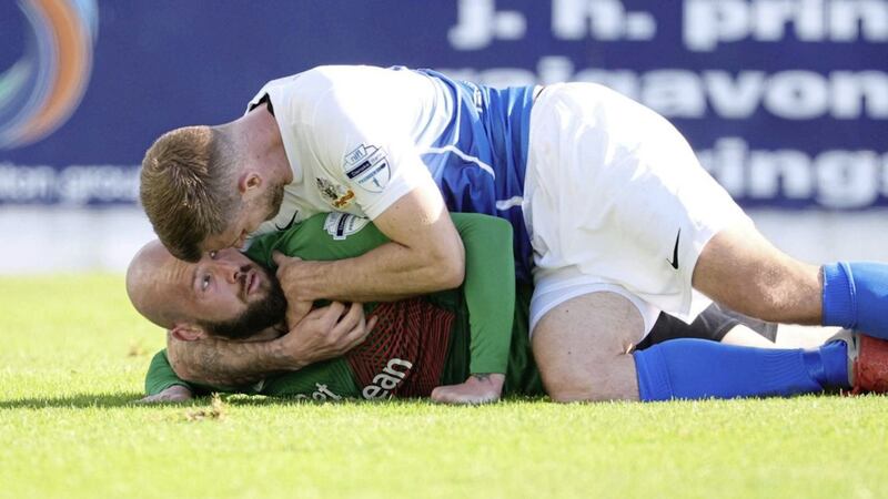 Glenavon's Michael O'Connor and Glentoran's Hrvoje Plum get to grips during the Premiership game at Mourneview Park, Lurgan back in October.
