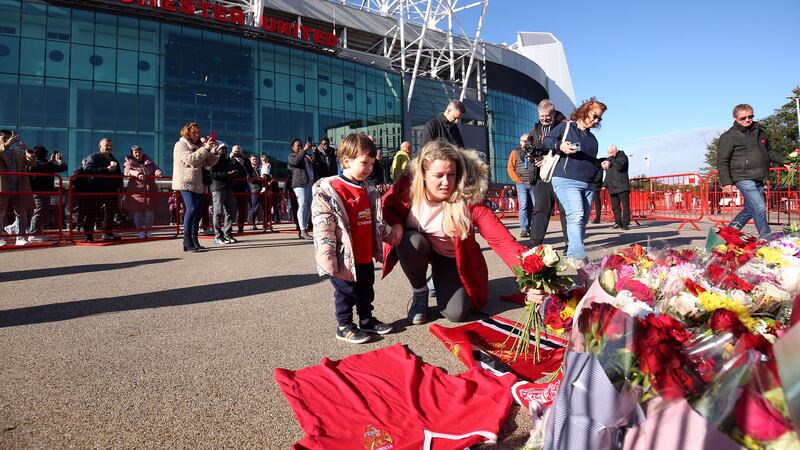 Tributes are laid in memory of Sir Bobby Charlton outside Old Trafford. Picture by Barrington Coombs/PA