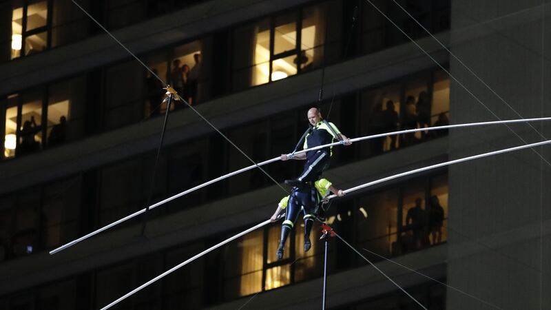 Two siblings from the circus act walked across the wire suspended 25 storeys above the ground.
