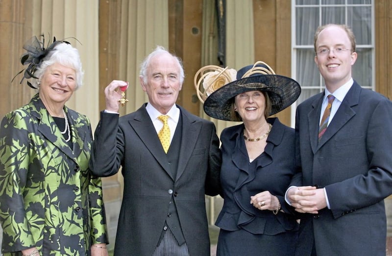 John with his wife Rosemary, son Jonathan and friend Mary Peters after he received his OBE 