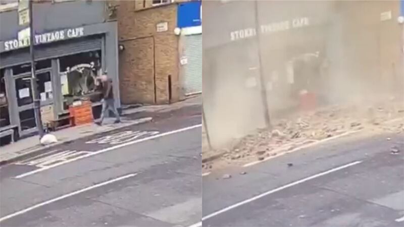 CCTV footage shows the man walking down Newington High Street in east London seconds before the wall collapses.