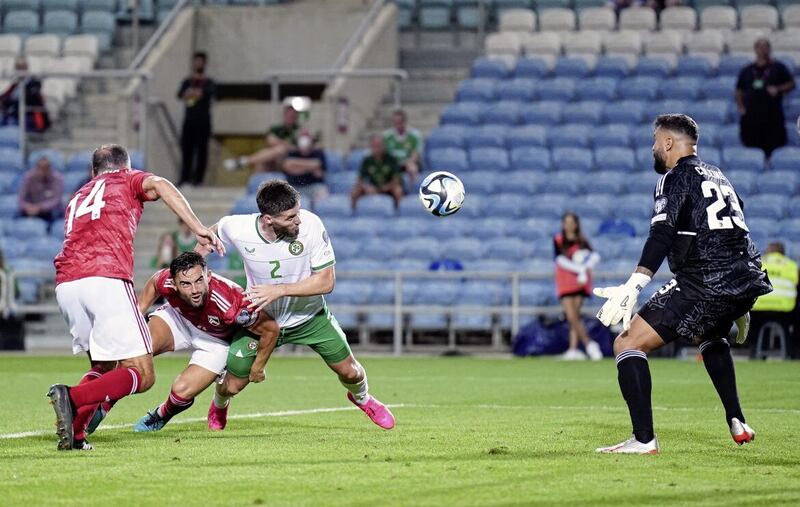 Republic of Ireland&#39;s Matt Doherty heads home his side&#39;s third goal 