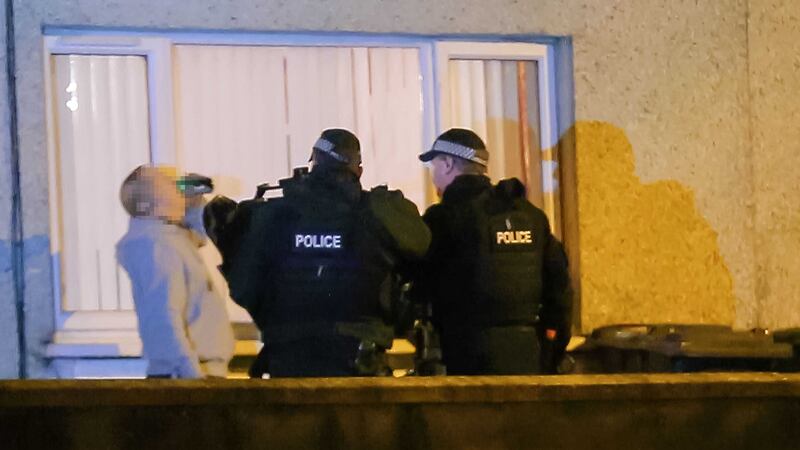 Heavily armed police raided a house in Aspen Walk in west Belfast and arrested two men.&nbsp;Picture by Kevin Scott