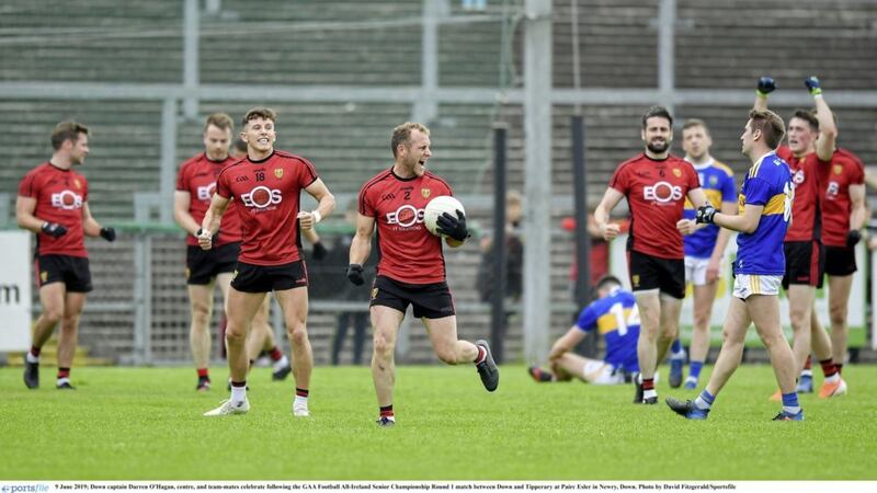 Down captain Darren O&#39;Hagan, centre, and team-mates celebrate following the GAA Football All-Ireland Senior Championship Qualifier against Tipperary at Pairc Esler 