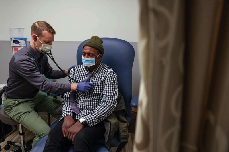 Desean Dixon, who has been homeless for over a decade, gets his heart checked by Dr. Stephen Matzat (left) at the Castro-Mission Health Center in San Francisco. Gabrielle Lurie/The Chronicle
