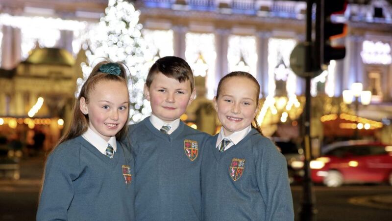 Lauren Chambers, Joshua Rooney and Tiernagh Donnelly from John Paul II Primary School spoke to Belfast city councillors about homelessness. Picture by Cliff Donaldson 