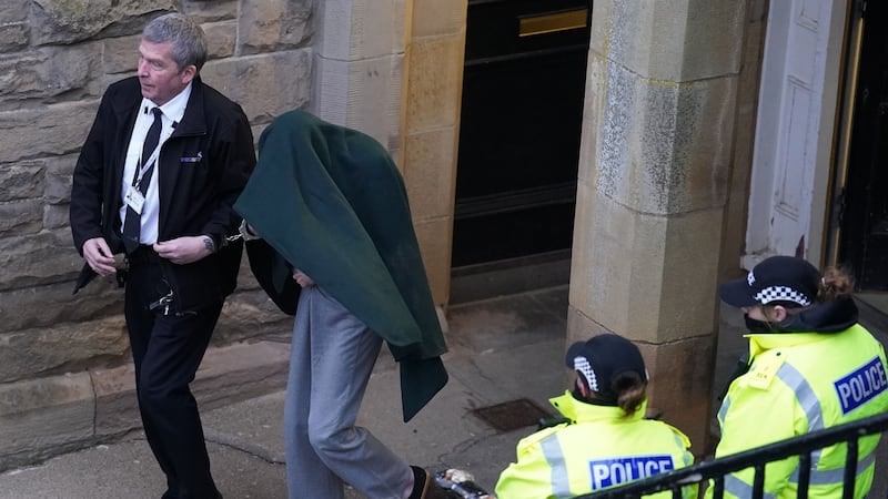 Andrew Miller hid under a jacket when leaving a previous court appearance (Andrew Milligan/PA)