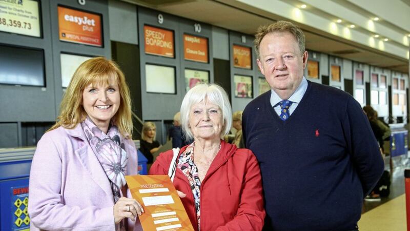 EasyJet&rsquo;s UK commercial director Ali Gayward congratulates the airline&rsquo;s 50 millionth customer to fly from Belfast International Airport, Isabel Patterson from Craigavon, watched by the airport&#39;s managing director Graham Keddie. Photo: Brian Thompson 