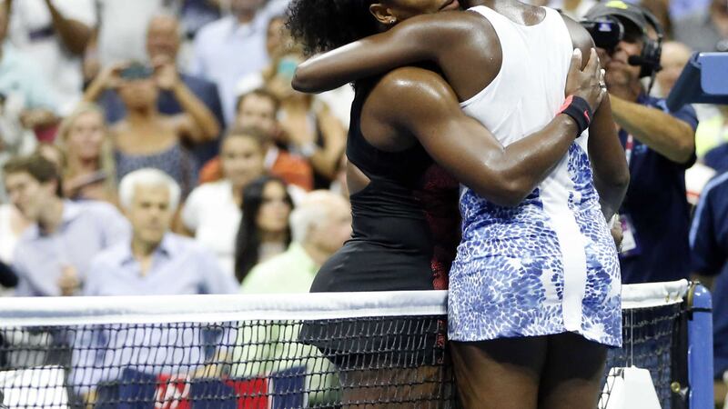 Serena Williams (left) hugs her sister Venus after winning their quarter-final clash at the US Open in New York<br />Picture: PA&nbsp;