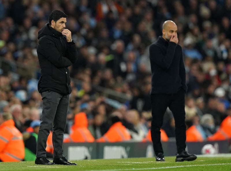 Mikel Arteta (left) and Manchester City manager Pep Guardiola