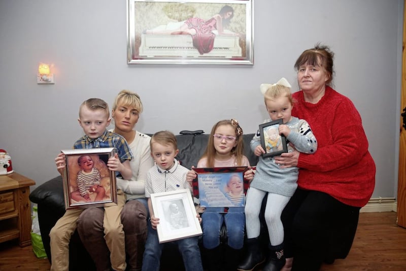 Poleglass mother, Kat Garland pictured with her mother Rosemary and other four children Ethan, Kyla, Ellie and Dylan. Ms Garland&#39;s youngest child, Shane died on December 1 after being diagnosed with a rare, genetic disorder. Photo by Mal McCann 