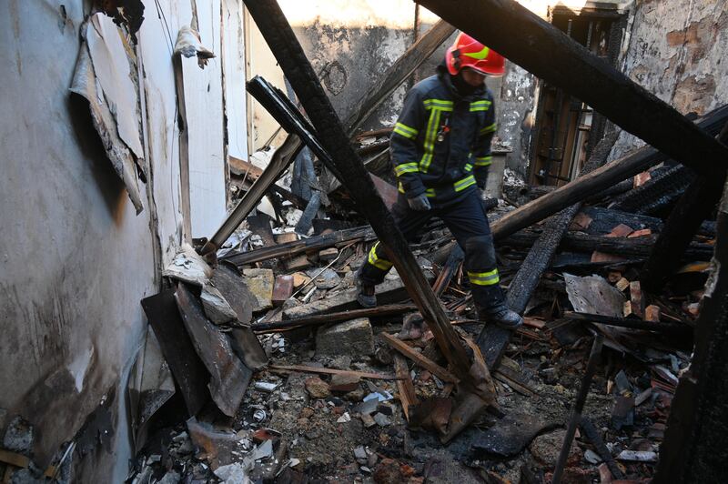 A rescue worker walks inside apartments destroyed by a Russian strike in Odesa (Michael Shtekel/AP)