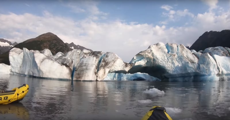 A glacier in Alaska as seen by two kayakers