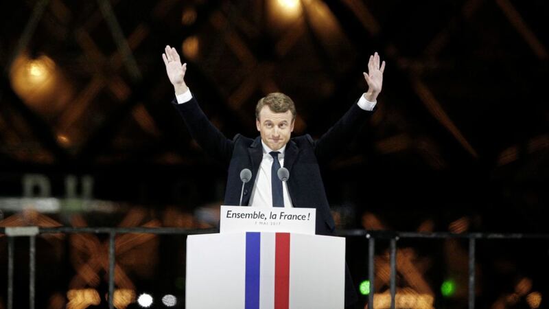 French president-elect Emmanuel Macron gestures during a victory celebration outside the Louvre museum in Paris on Sunday May 7 PICTURE: Thibault Camus/AP 