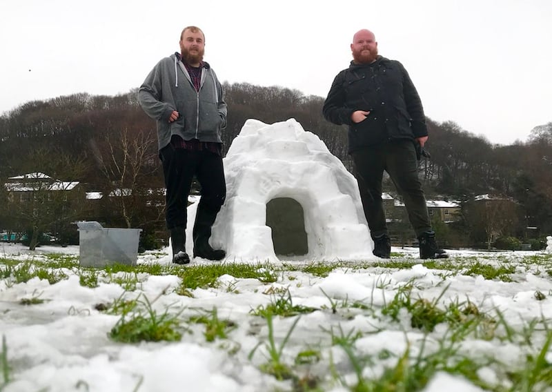Ben Pickering and Farran Chandler with their igloo in Hebden Bridge (Ben Pickering/PA)