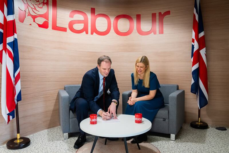 Dr Dan Poulter signing his Labour Party membership form with Ellie Reeves MP, Labour’s deputy national campaign co-ordinator