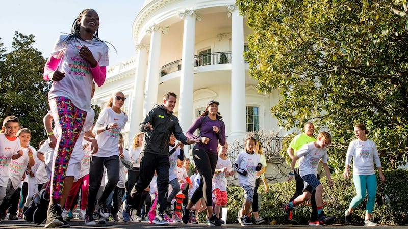 First lady Michelle Obama, centre, participates in her first ever &quot;fun run&quot; with children on the South Lawn of the White House in Washington. Picture by&nbsp;Andrew Harnik, Associated Press&nbsp;