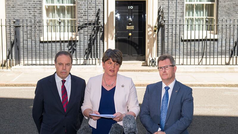 DUP leader Arlene Foster, DUP deputy leader Nigel Dodds (left) and MP Sir Jeffrey Donaldson outside 10 Downing Street in London after the party agreed a deal to support the minority Conservative government&nbsp;