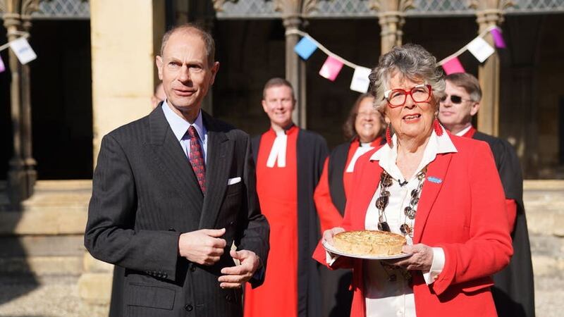 The Duke of Edinburgh and Coronation Big Lunch Ambassador Dame Prue Leith with the official coronation quiche at a Coronation Big Lunch hosted by the Archbishop of Canterbury (James Manning/PA)