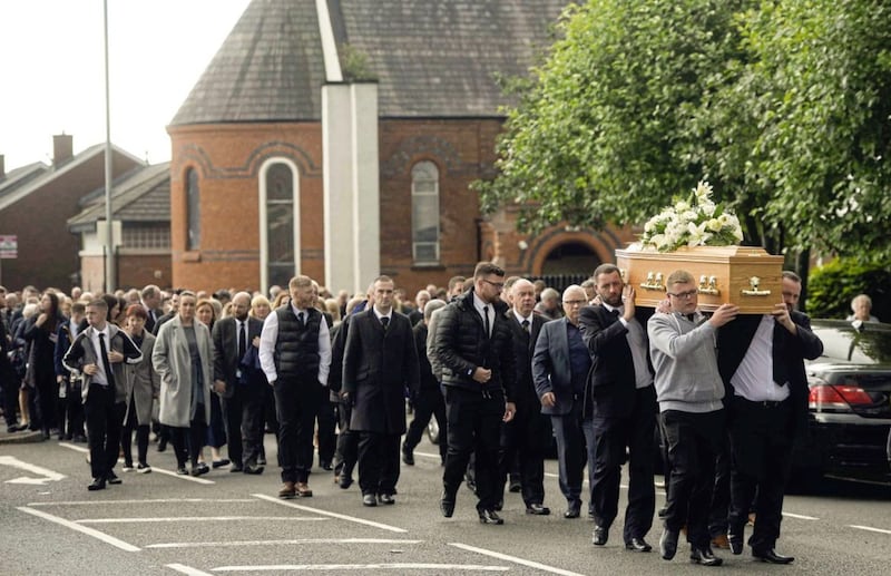 The funeral cortege leaves the church after requiem mass for Belfast man Colin McGarry. Picture Mark Marlow 