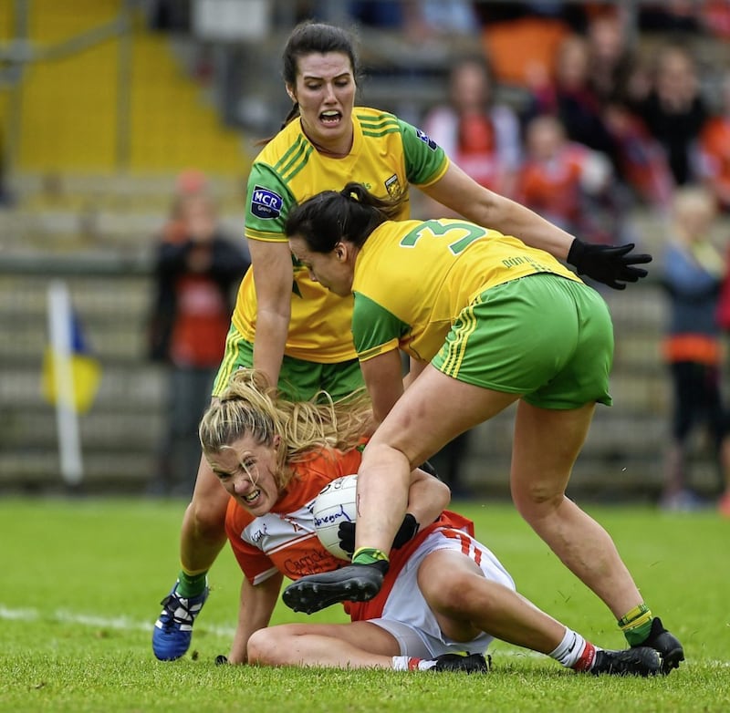 Kelly Mallon of Armagh comes under pressure from against Donegal&#39;s Emer Gallagher (left) and Nicole McLaughlin during the TG4 Ulster Ladies Football Senior Championship Final at Brewster Park in Enniskillen, Fermanagh on June 17 2018. Picture by Daire Brennan/Sportsfile. 